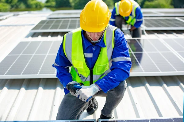 Technology solar cell, Engineer service checks installation solar cell on the roof of factory. technicians check the maintenance of the solar panels, engineering team working