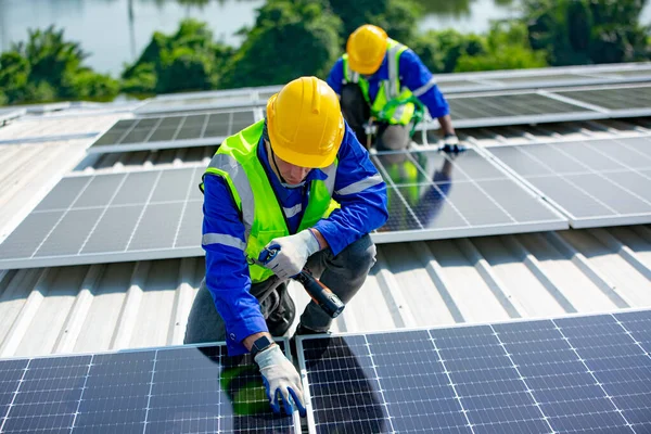 Technology solar cell, Engineer service checks installation solar cell on the roof of factory. technicians check the maintenance of the solar panels, engineering team working