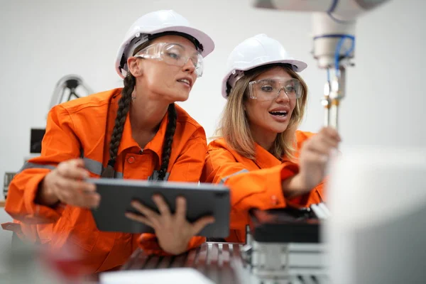 stock image Engineers checking and controling  machine in intelligent factory automotive industrial with monitoring system software. 