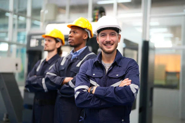 stock image portrait of male workers standing at factory