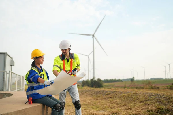 Wind turbine service engineer maintenance and plan for inspection at construction site, renewable electricity generator