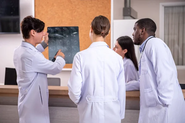 stock image Healthcare professionals discussing in hospital