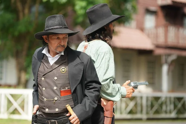 stock image Brutal cowboys with revolvers on texas ranch, wild west lifestyle