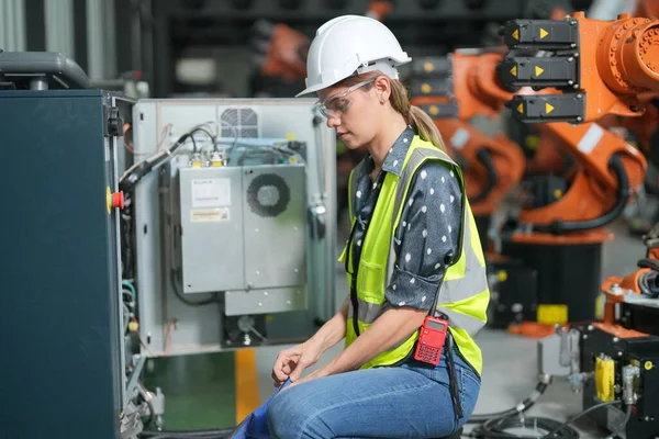 stock image Robotic Arm engineer checking  equipment with software of an Artificial Intelligence, Programming development technology work