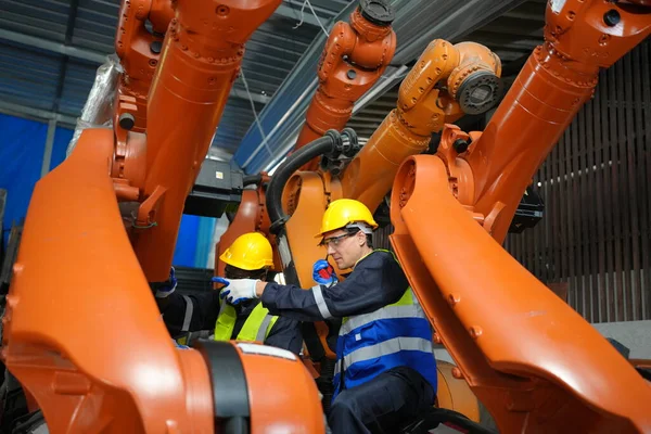 Stock image Robotic Arm engineers checking equipment of Artificial Intelligence Computer Processor Unit