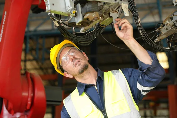 stock image Robotic Arm engineer checking equipment of an Artificial Intelligence Computer Processor Unit