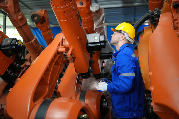 Robotic Arm engineer checking equipment of Artificial Intelligence Computer Processor Unit