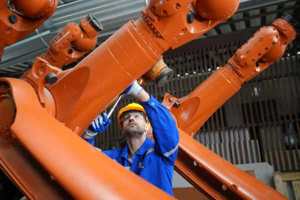 stock image Robotic Arm engineer checking equipment of an Artificial Intelligence Computer Processor Unit