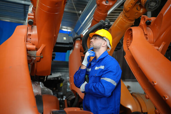 Robotic Arm engineer checking equipment with software  of an Artificial Intelligence Computer Processor Unit