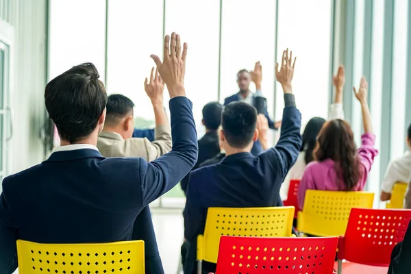 stock image conference meeting. Business people sitting in a room listening to the motivator coach. Representation of a Self-growth and improvement special event