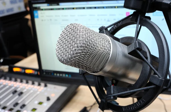 Studio microphone set during radio marathon to Radio Day at a radio studio, closeup.