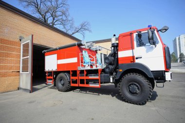 Fire truck driving out of the garage for firefighting, firehouse. April 5, 2019. Forestry of Sviatoshyn district, Kievskaya oblast, Ukraine