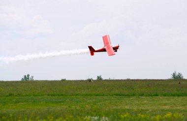 Light sport plane flying above the landing field. Kiev, Ukraine