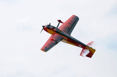 Radio controlled plane flying in the sky performing aerobatics. Kyiv, Ukraine