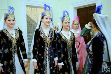 Young women dancers in oriental costumes waiting for performance at backstage. Festival of Oriental culture. March 20, 2018. Kyiv, Ukraine