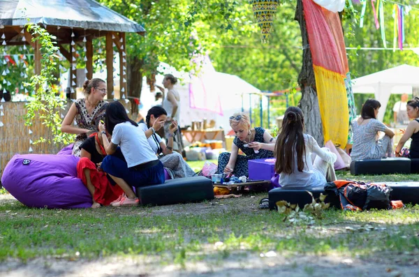 Young Women Sitting Beanbags Camp Relaxing Festival Yoga Vedic Culture — стокове фото