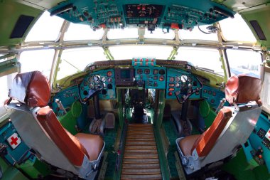 The cockpit of made in Ukraine transport aircraft, steering wheel, dashboards, two seats for pilots.