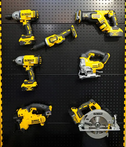 stock image Portable electric hand held tools saw, screwdriver, drill made by DeWALT. November 19, 2019. Kiev, Ukraine