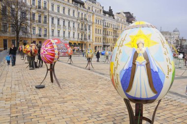 Big painted Easter eggs installations presented on the square, people walking around. Festival of Folk art. April 18, 2018. Kyiv, Ukraine