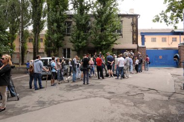 Journalists waiting for permission to enter Lukyanovskaya detention facility zone. July 18,2017. Kiev,Ukraine clipart