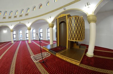 hall for praying iwan of the Ar-Rahma Mosque or Mercy Mosque with minbar pulpit. Kyiv, Ukraine. clipart