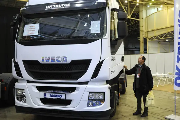 stock image Man standing near heavy truck during Exhibition TransUkraine-2019. January 5, 2019. Kyiv, Ukraine