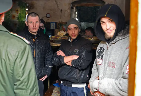 Stock image Criminals standing in a cell and complaining about conditions, prison guard watching. February 21, 2018. Kyiv, Ukraine