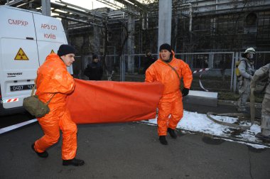 Rescue team deploying equipment from mobile chemical radiological laboratory, training. February 21,2019. Kyiv, Ukraine clipart