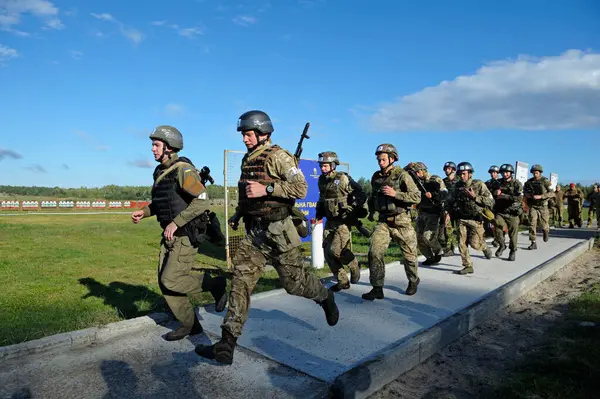 stock image On a military training ground: Ukrainian soldiers cross country running. October 18, 2018. Novo-Petrivtsi, Ukraine