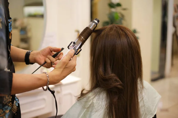 Male Hairdresser Ironing Woman Hair —  Fotos de Stock