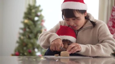 Parent and child cutting sweets