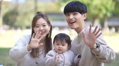 parent and child waving