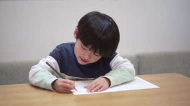 Image of a boy practicing handwriting
