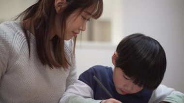 Parents and children practicing calligraphy