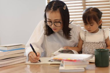 mother studying at home
