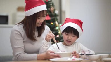 Parent and child building a Hexenhaus