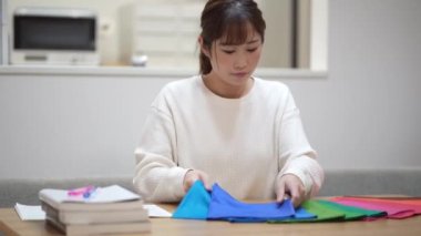 Woman studying colors at home