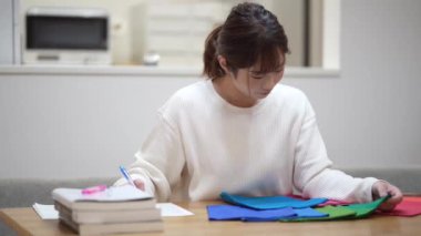 Woman studying colors at home