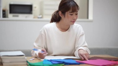 Woman studying colors at home