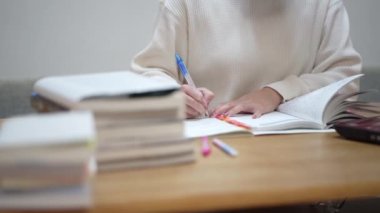 woman studying with a laptop
