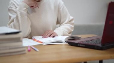 woman studying with a laptop