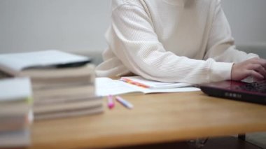 woman studying with a laptop