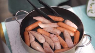 Image of a woman baking sausages