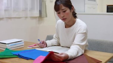 Woman studying colors at home