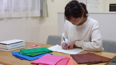 Woman studying colors at home