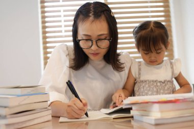 mother studying at home