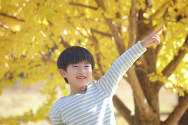 smiling boy playing in the park