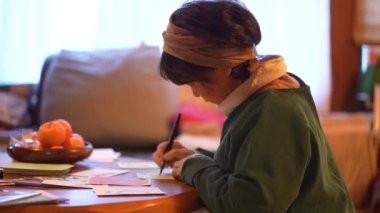 woman writing a picture letter