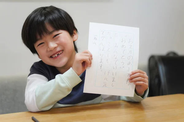 Image of a boy practicing handwriting