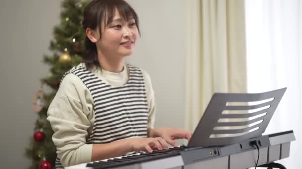 Nursery Teacher Playing Piano Image — Stockvideo